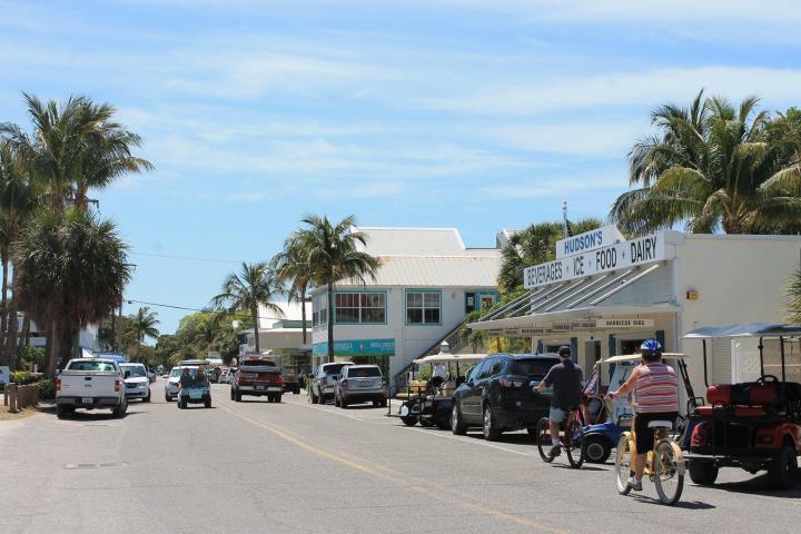a group of people riding on the back of a car
