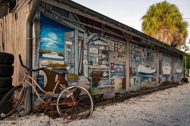 a bicycle parked on the side of a building