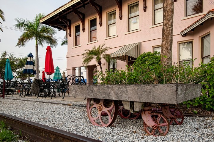 a close up of a horse drawn carriage in front of a house