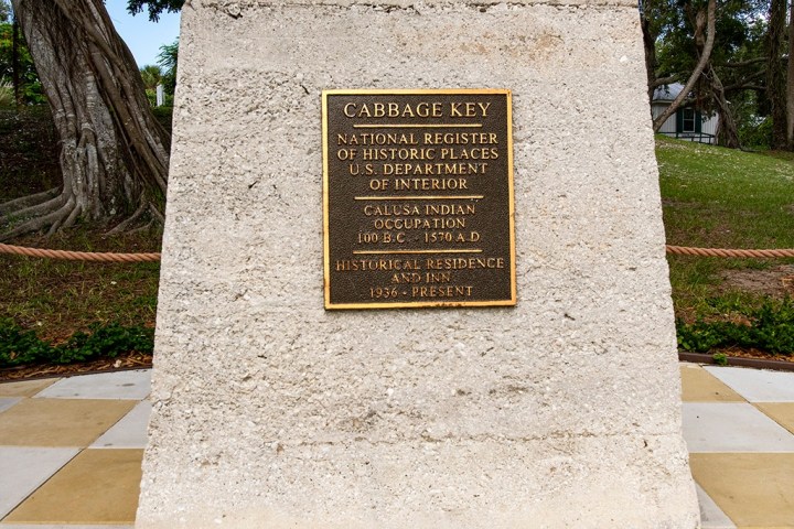 a sign on a sidewalk