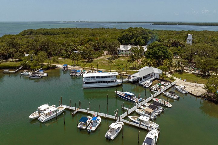 a boat is docked next to a body of water