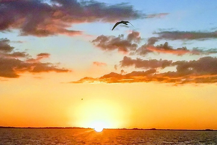 a sunset over a body of water