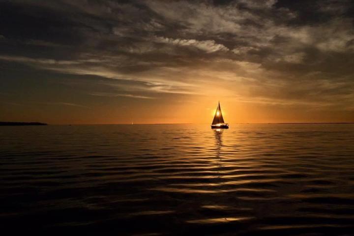 a sunset over a body of water