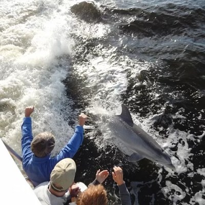a man riding a wave on a surfboard in the water